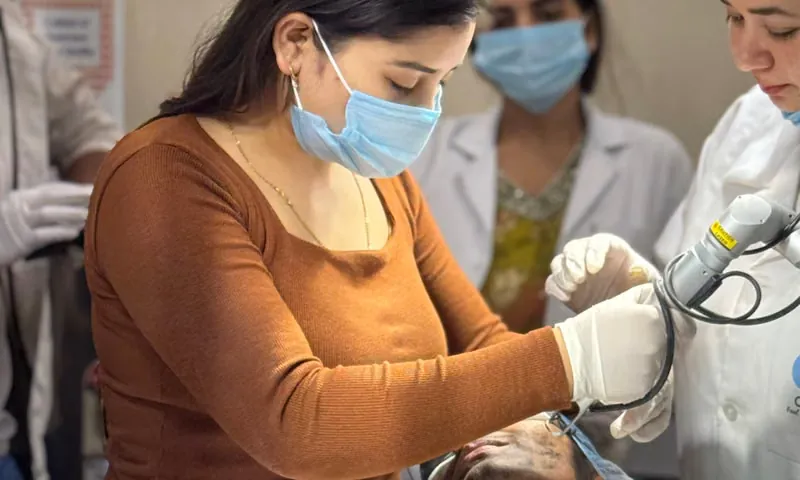 Woman experiencing jaw pain and TMJ disorder discomfort at dental clinic in Sarjapura Bangalore